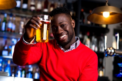 Man holding glass of beer