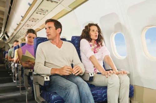 Worried looking couple on plane