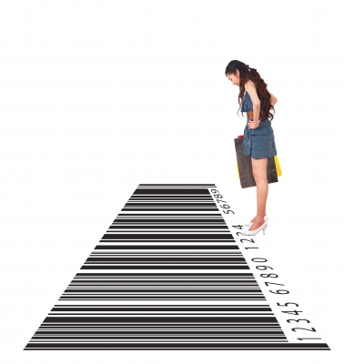 Woman looking at large bar code